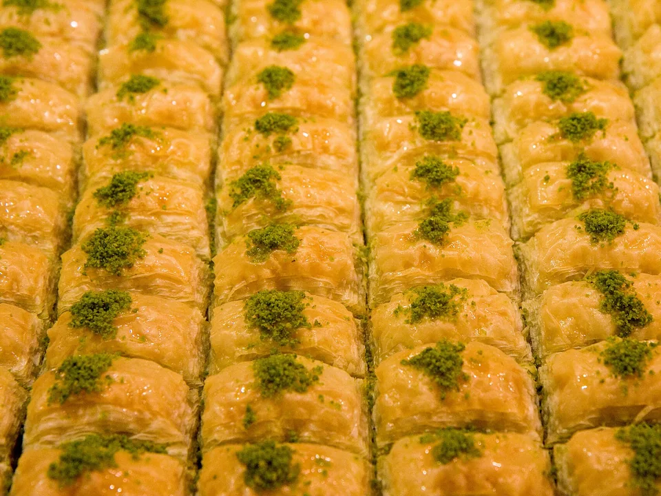 Turkish-style pistachio baklava diamonds glossed with lemon-rose syrup