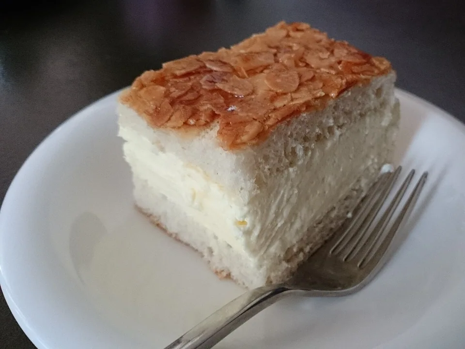German Bienenstich yeast cake with caramelized almond top and vanilla cream filling