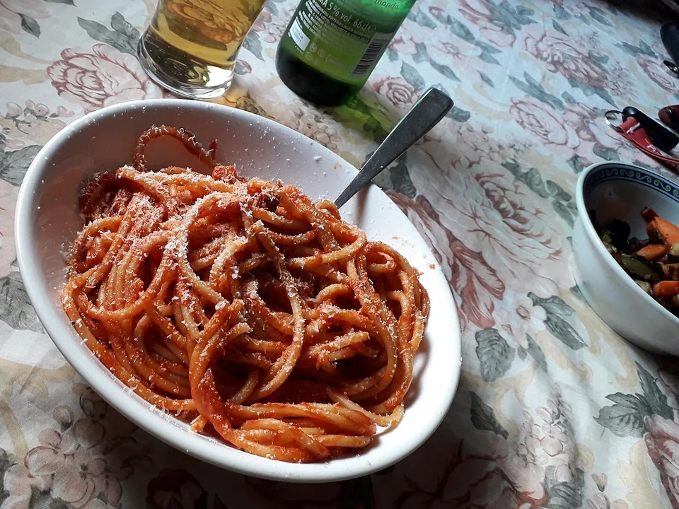 Bucatini all’Amatriciana with red tomato sauce, guanciale and Pecorino