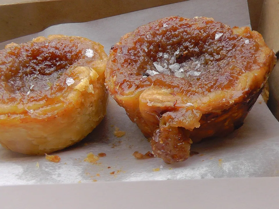 Ontario butter tarts with flaky pastry and glossy currant filling