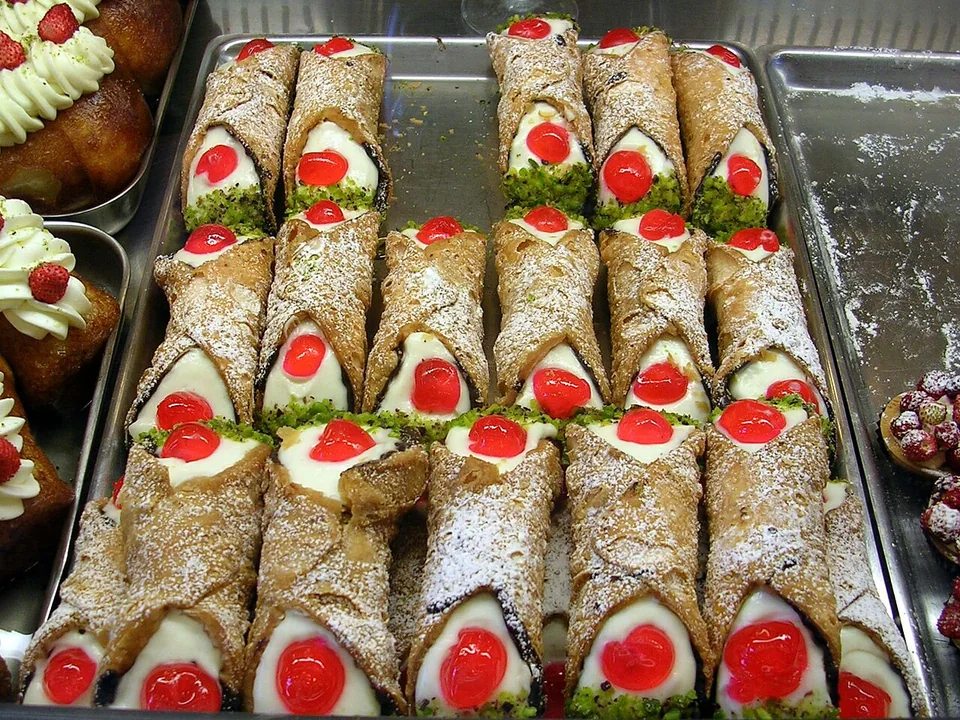 Sicilian cannoli with blistered shells, ricotta-chocolate filling and pistachio ends