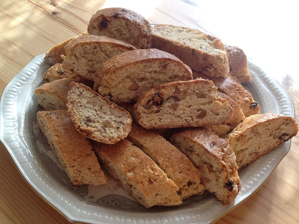 Golden sliced cantucci with whole almonds visible in the crisp crumb