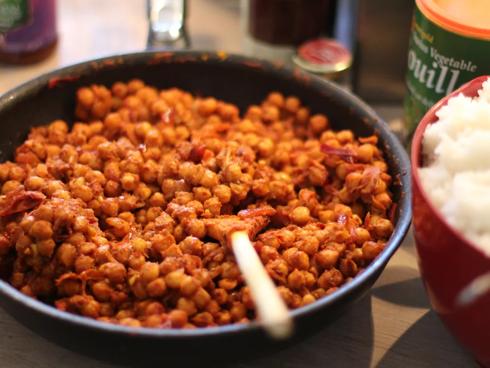 Chana masala with tender chickpeas in thick reddish-brown onion-tomato gravy and cilantro