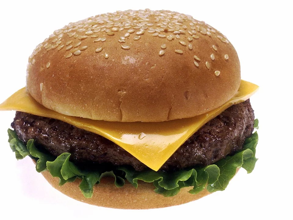 American cheeseburger with browned beef, melted cheese and crisp toppings