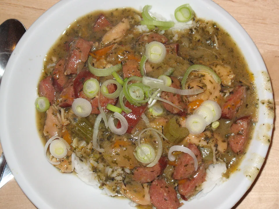 Dark chicken and sausage gumbo with okra over white rice