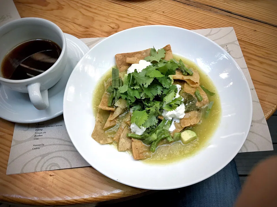 Green chilaquiles with crema, queso fresco, onion and cilantro