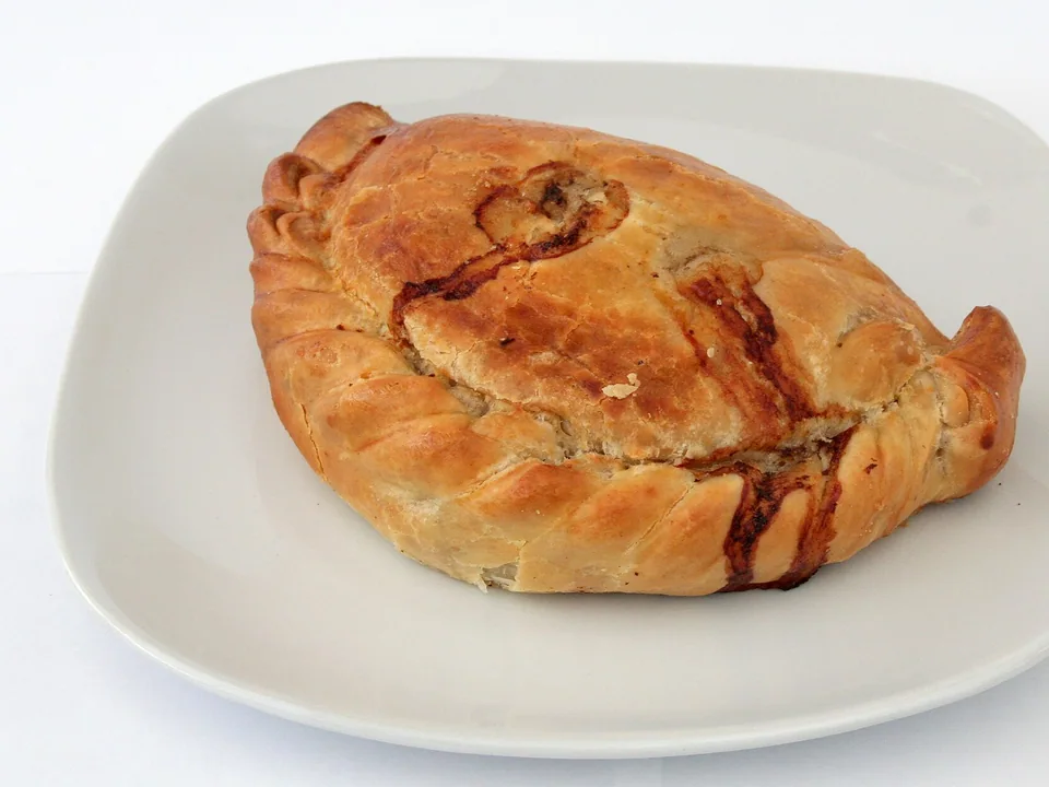 Golden Cornish pasty with a thick side crimp