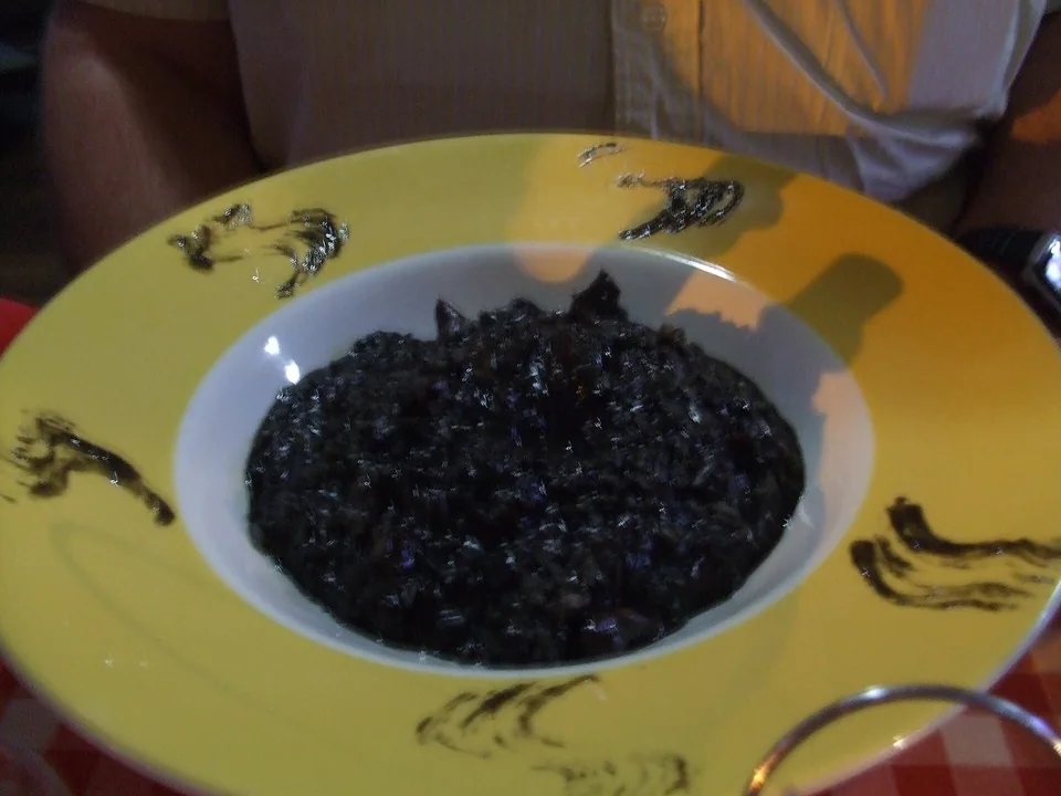 Dalmatian black risotto with tender cuttlefish, parsley and lemon