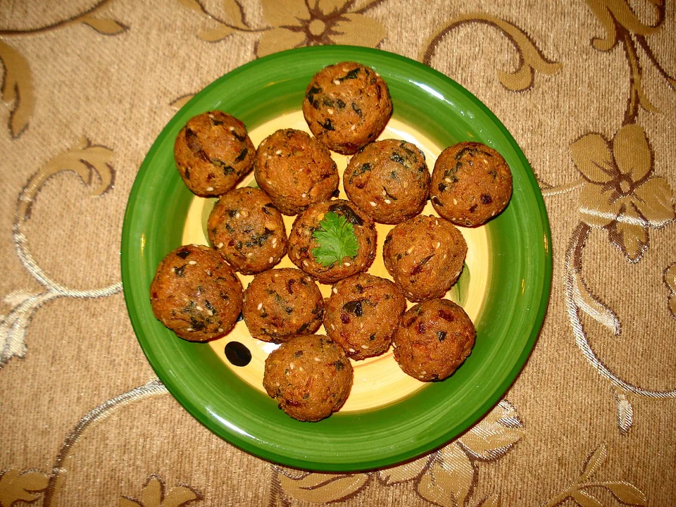 Crisp herb-flecked chickpea falafel balls with a green tender centre