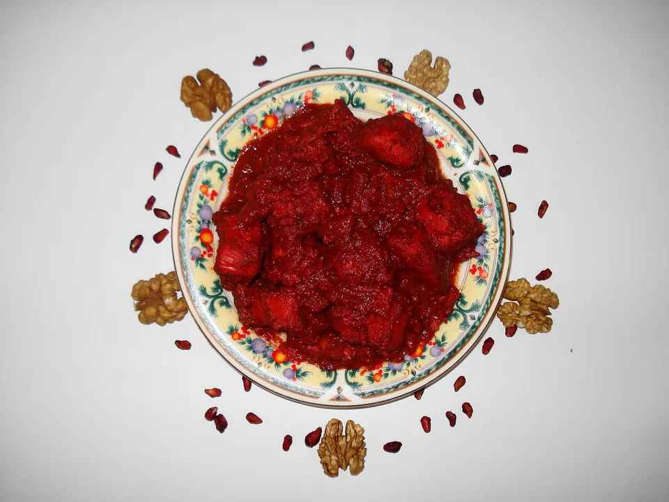 Persian fesenjan chicken braised in walnut and pomegranate sauce over basmati rice