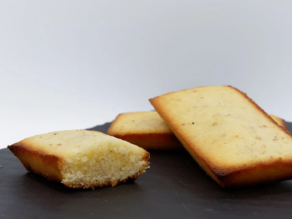 Small golden rectangular almond financiers with crisp edges