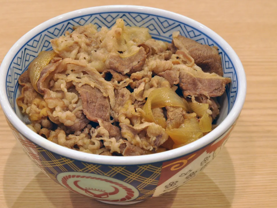 Gyudon beef and tender onion simmered in sauce over white rice without garnish