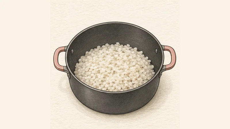 Arroz con Leche, step 1: Part-cook the rice in water.