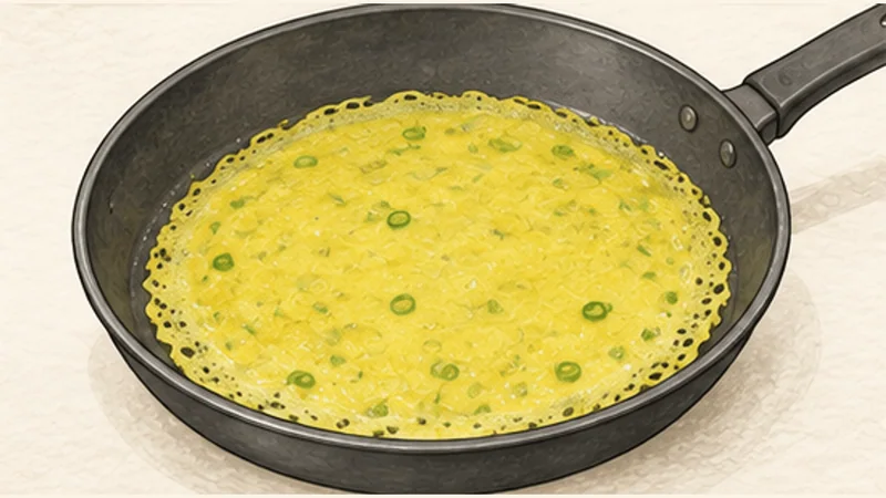 Bánh Xèo — Sizzling Pork and Shrimp Crêpes, step 5: Spread one thin crêpe.