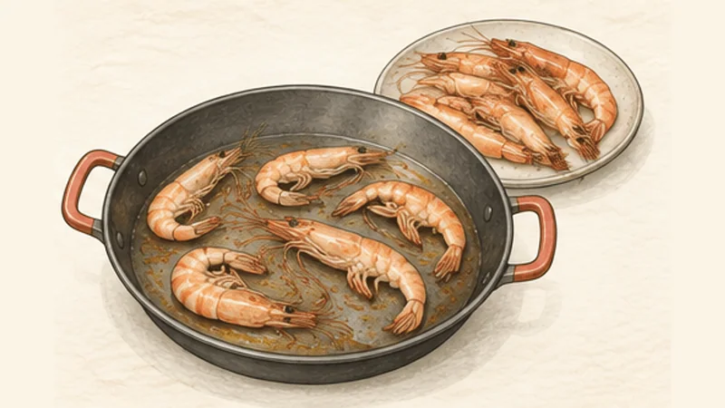 Fideuà, step 2: Sear the prawns.