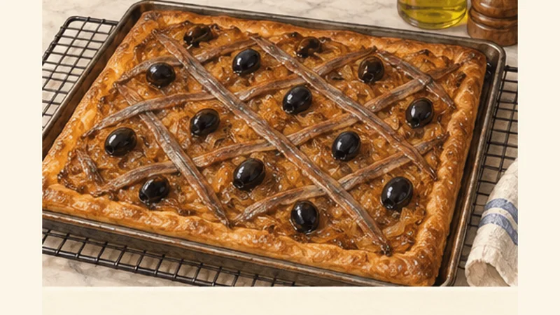 Niçoise Pissaladière with Anchovies and Olives, step 6: Bake until the crust is golden.