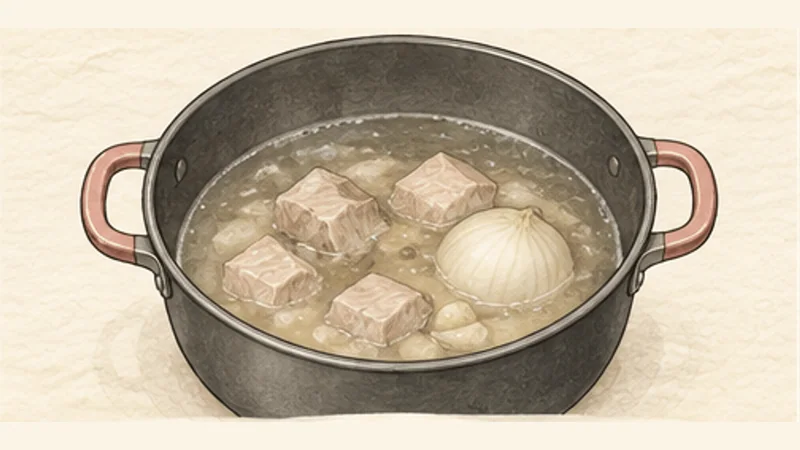 Pozole Rojo, step 2: Skim and simmer the pork.