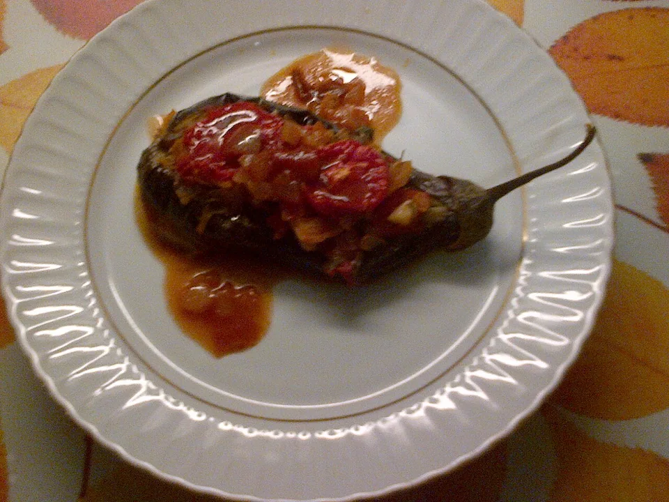 Turkish imam bayildi eggplants filled with slow-cooked onion, tomato, garlic and parsley