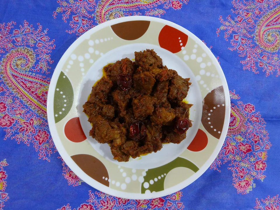 West Sumatran beef rendang reduced to a dark coconut spice coating with rice
