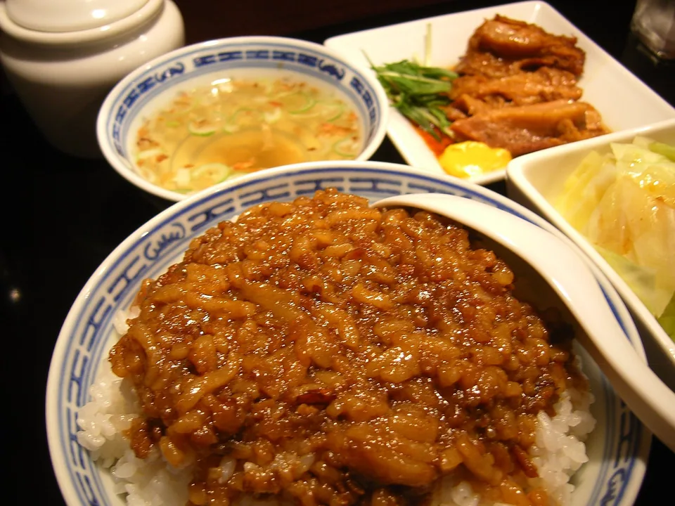 Lu rou fan with diced braised pork, shiitake, egg, greens, and crisp shallots over rice
