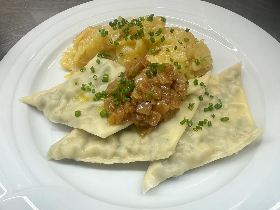 Swabian Maultaschen filled pasta parcels in clear broth