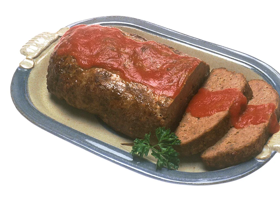 Classic glazed American meatloaf cut into thick slices