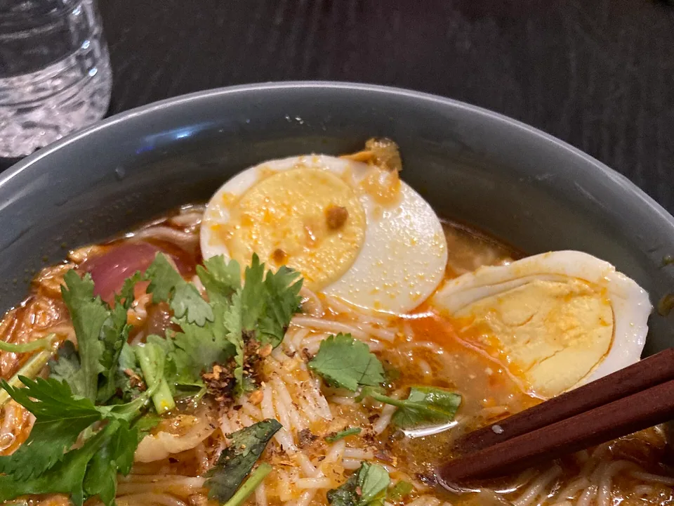 Myanmar mohinga fish noodle soup with catfish, boiled egg, banana stem and lime