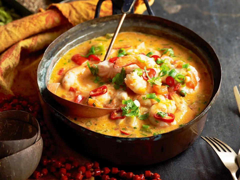 Bahian moqueca with fish, shrimp, coconut broth, peppers and cilantro