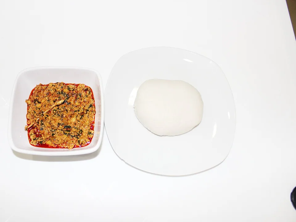 Nigerian egusi soup with melon-seed curds, beef, smoked fish and leafy greens