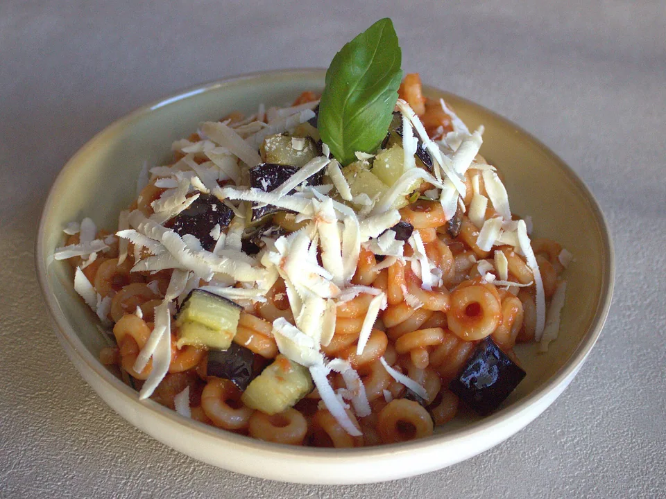 Pasta alla Norma with tomato, golden eggplant, ricotta salata and basil