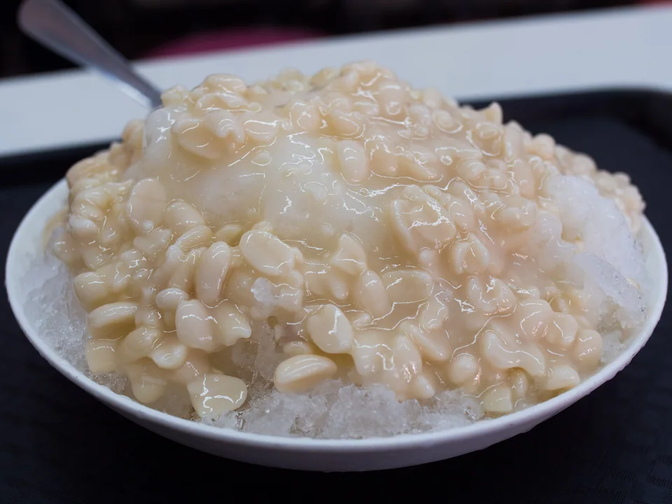 Taiwanese shaved ice with brown-sugar syrup, tender peanuts, crushed roasted peanuts, and condensed milk