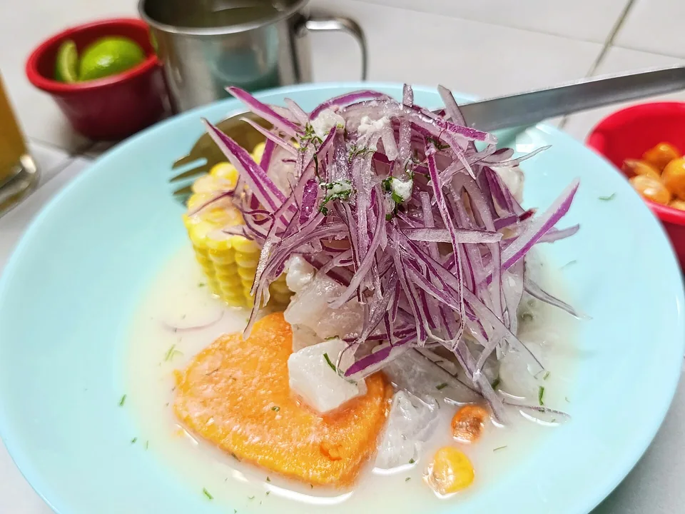 Peruvian fish ceviche with lime, ají chilli, red onion, sweet potato and corn