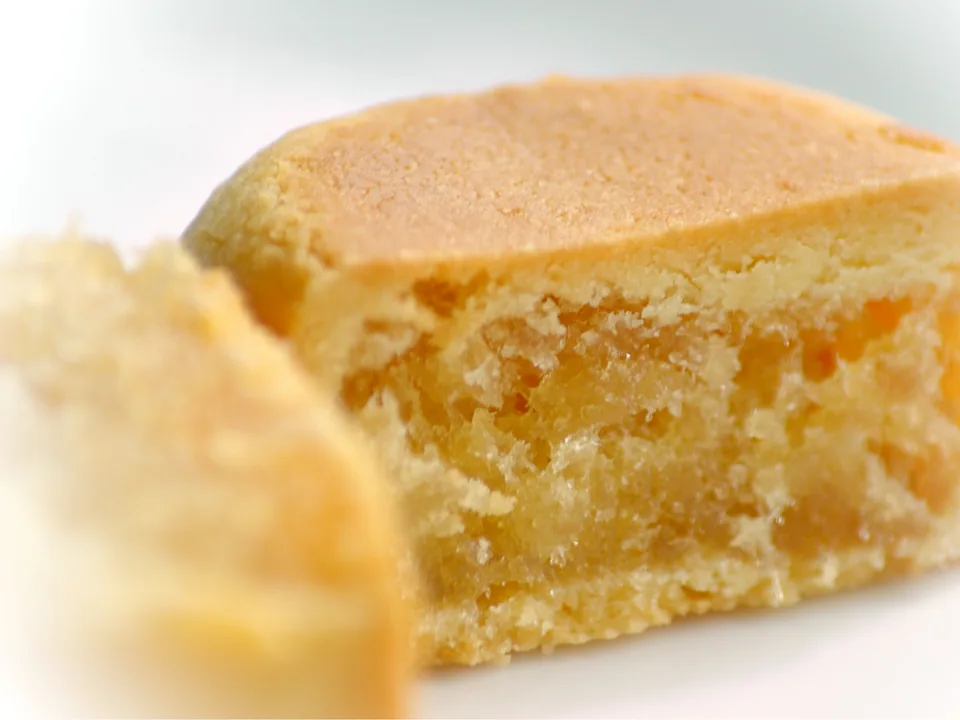 Rectangular Taiwanese pineapple cakes with pale-golden pastry and fibrous pineapple filling