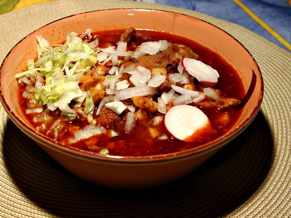 Red pozole with pork, hominy, cabbage and radish
