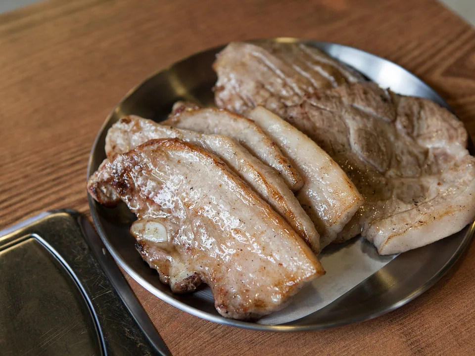 Fully cooked browned pork-belly slices for Korean lettuce wraps