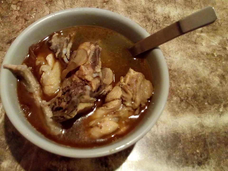 Taiwanese sesame oil chicken soup with bone-in chicken, browned ginger, and goji berries