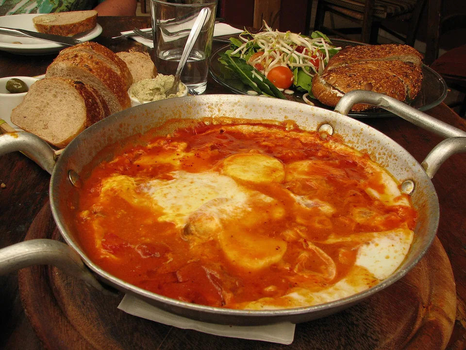 Soft-yolk eggs poached in a thick spiced tomato and pepper skillet