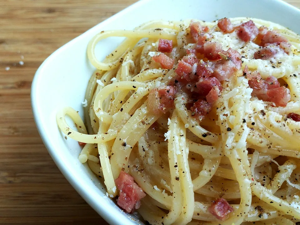 Glossy spaghetti carbonara with crisp guanciale, Pecorino and black pepper