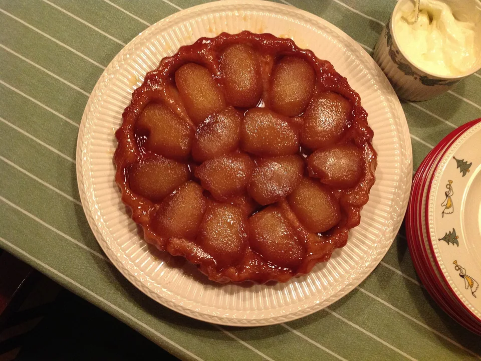 Upside-down apple tart with glossy caramelized apple halves