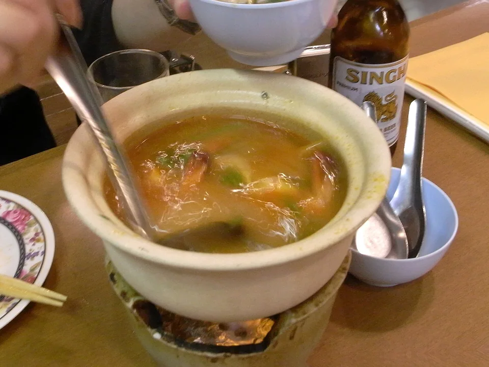 Clear Tom Yum Goong with shrimp, mushrooms, lemongrass, galangal, lime leaves, and chiles