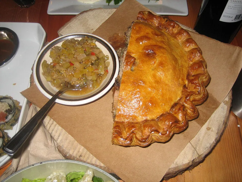 Golden Québec tourtiere meat pie with flaky pastry