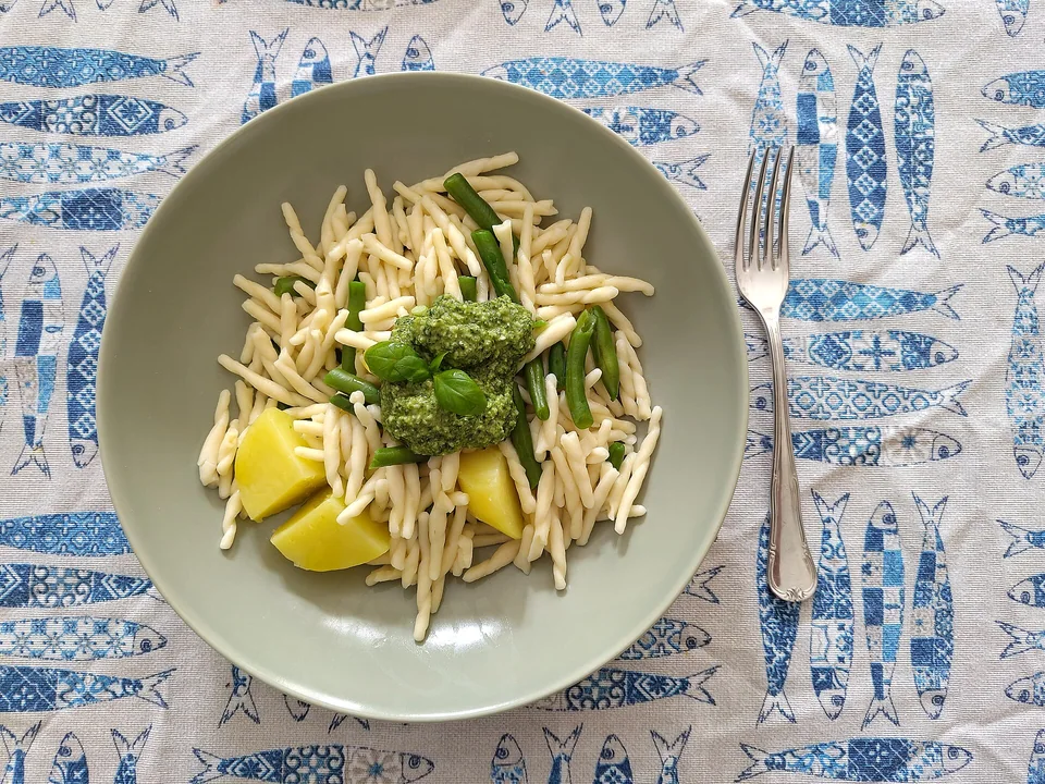 Trofie with bright green pesto, potato and green beans