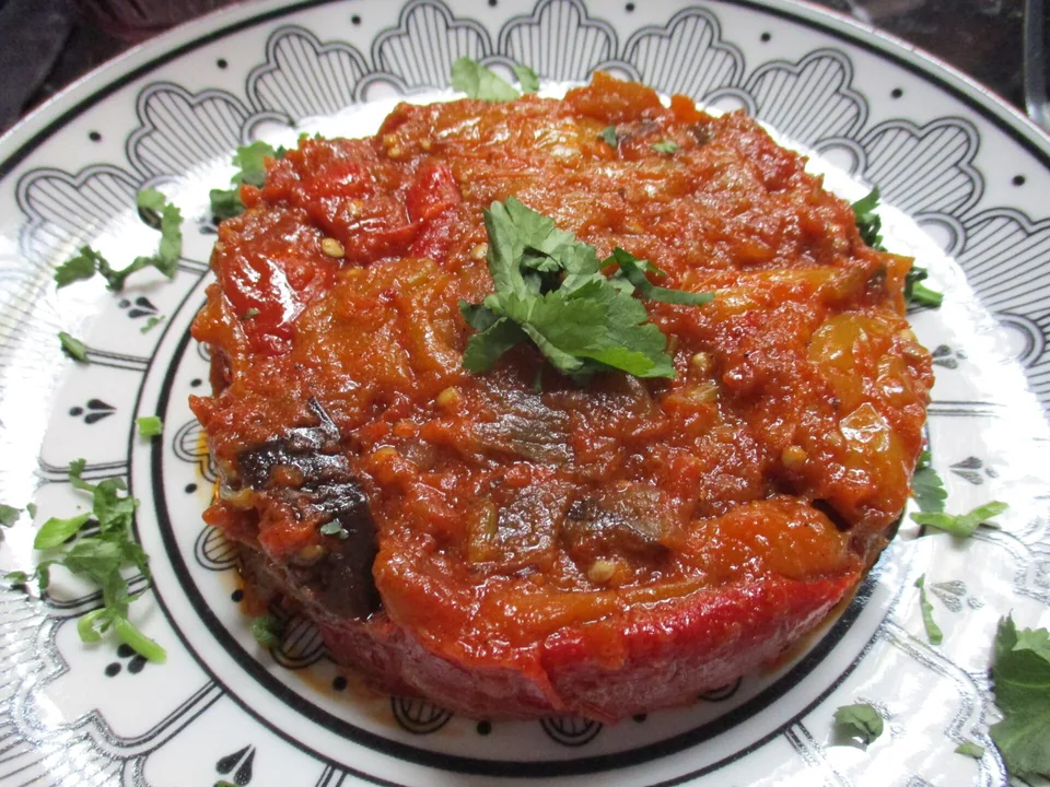Moroccan zaalouk made with eggplant, tomato, garlic, cumin and paprika, served with bread